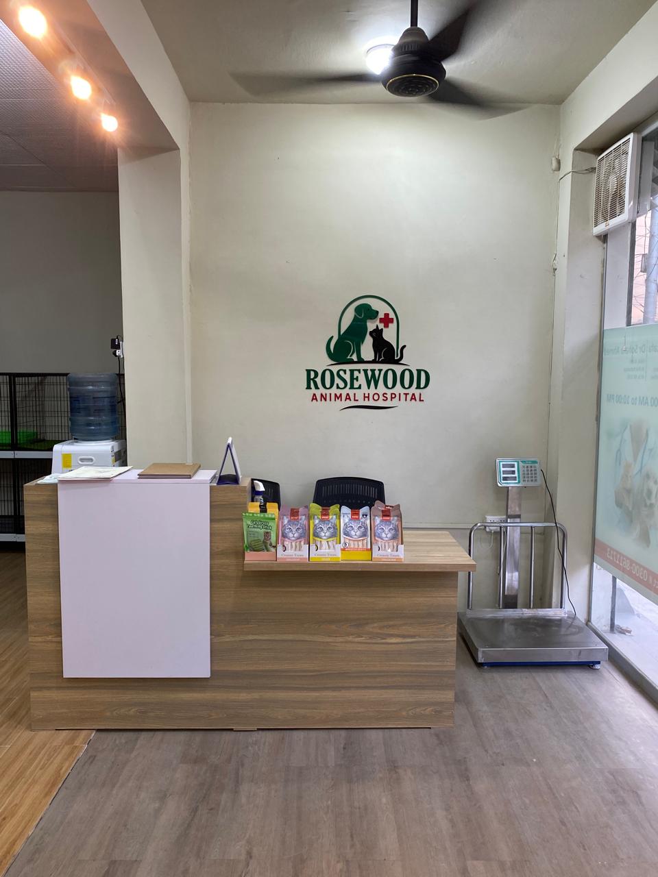 Rosewood Animal Hospital reception desk with the hospital logo on the wall