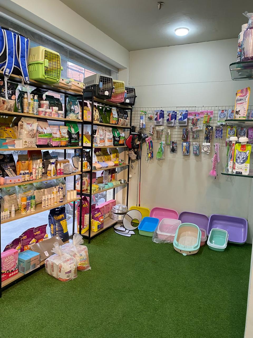 Shelves of pet food, litter trays, carriers and accessories at Rosewood Animal Hospital